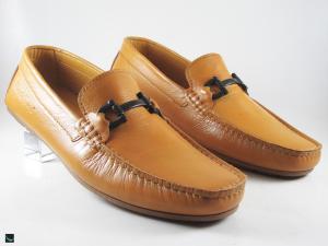 Stylish tan loafers with black buckle